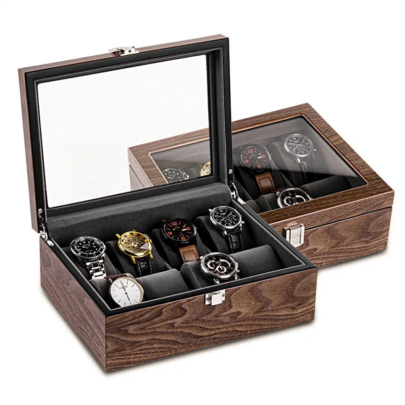 Boite A Montres 8 Emplacements en bois avec couvercle en verre ouvert, présentant plusieurs montres aux designs variés, placées dans des compartiments rembourrés.