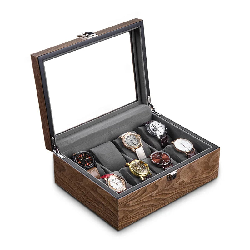 Une Boite Pour 10 Montres en bois avec un couvercle en verre ouvert, présentant huit montres aux motifs variés nichées sur des rouleaux rembourrés.