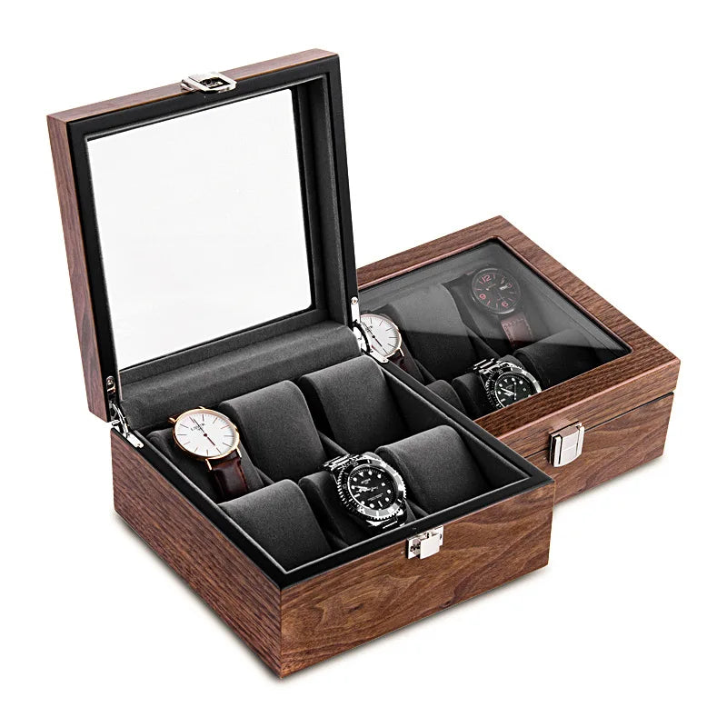 Description modifiée : Une Boite Rangement 6 Montres Bois présentant cinq montres sur des rouleaux rembourrés, avec un couvercle en miroir et des fermoirs métalliques de Boites Lefiguet.