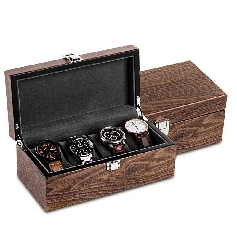 Un coffret à montres en bois Boites Lefiguet avec son couvercle ouvert, présentant quatre montres aux motifs variés, sur fond blanc, idéal pour les collectionneurs de montres.