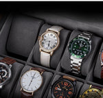 Une collection de montres de luxe Boites Lefiguet présentées dans un coffret à montres en bois, comprenant des modèles avec des bracelets en or, cuir et métal.