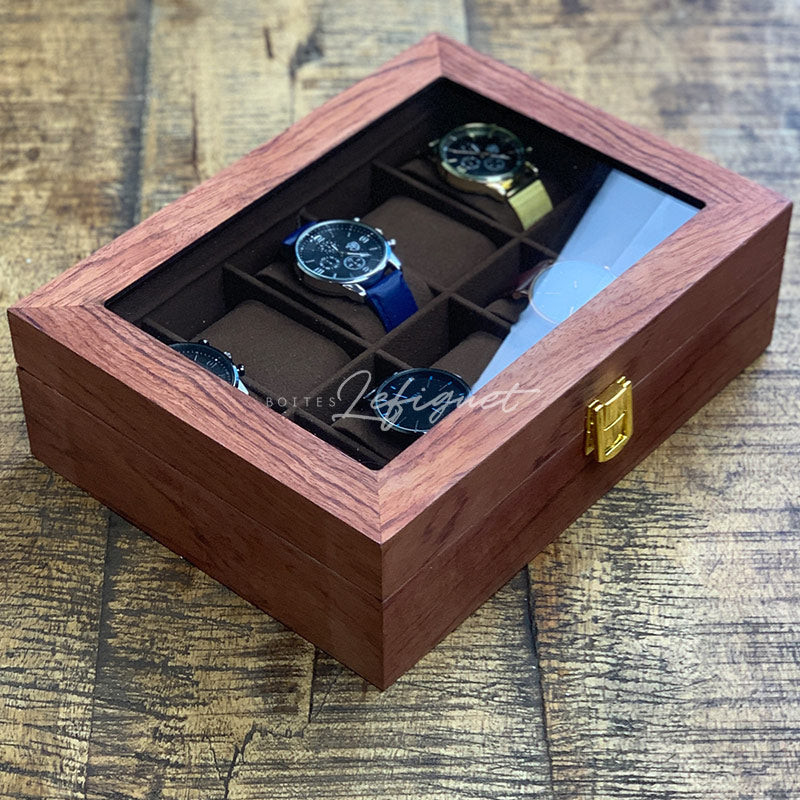 Une boîte à montres Boite a Montre Bois Luxueux à 10 fentes de Boites-lefiguet.com contenant quatre montres.
