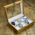 Une boîte à montres Boite a Montre Bois Luxueux à 10 fentes de Boites-lefiguet.com contenant quatre montres.
