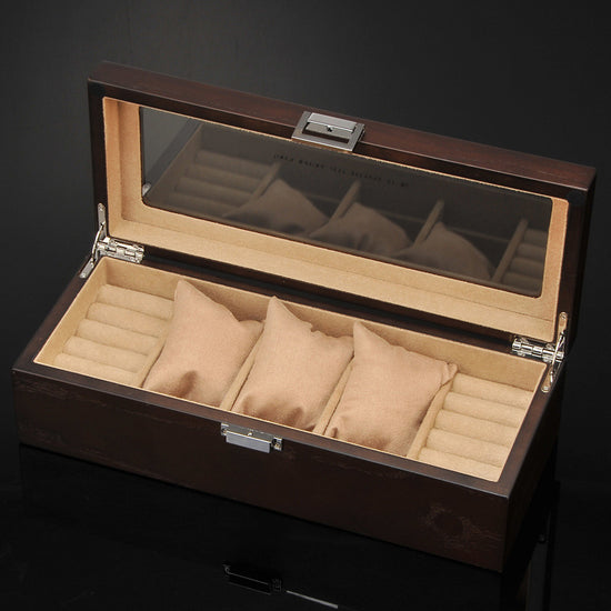 Une boîte à montres en bois Boites Lefiguet à trois compartiments.