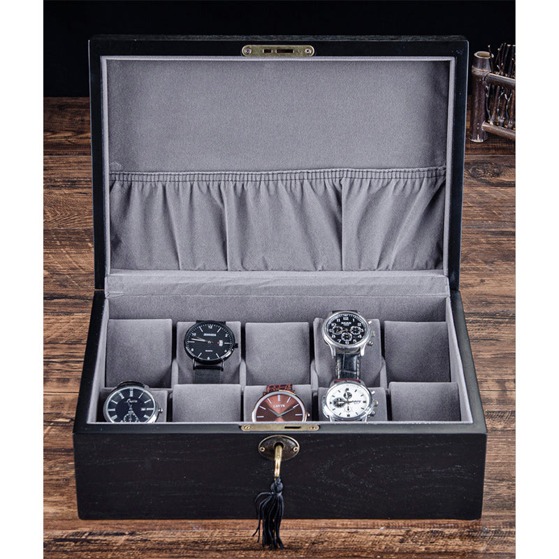 Un coffret avec plusieurs Coffret Rangement 10 Montres de Boites Lefiguet à l'intérieur.