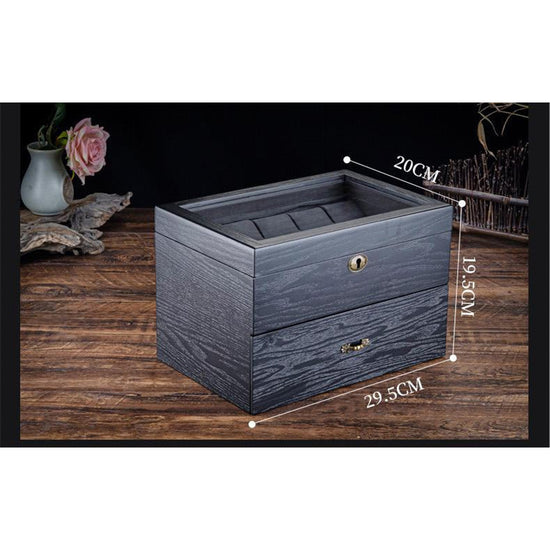 Une boîte à bijoux en bois noir Coffret Rangement Montre avec deux tiroirs de Boites Lefiguet.
