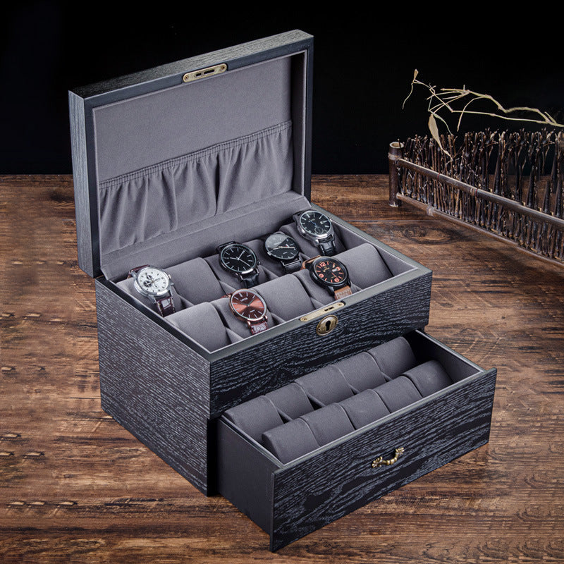 Un Coffret Rangement Montre par Boites Lefiguet avec plusieurs montres dedans.