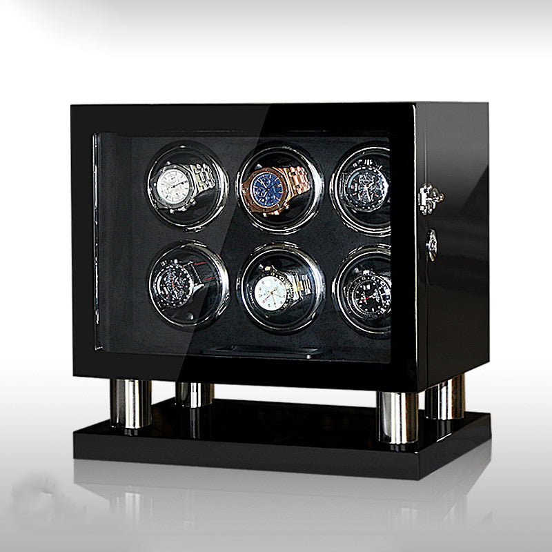 Un remontoir Montre Mécanique à 6 emplacements avec six montres dessus. (Nom de marque : Boites Lefiguet)