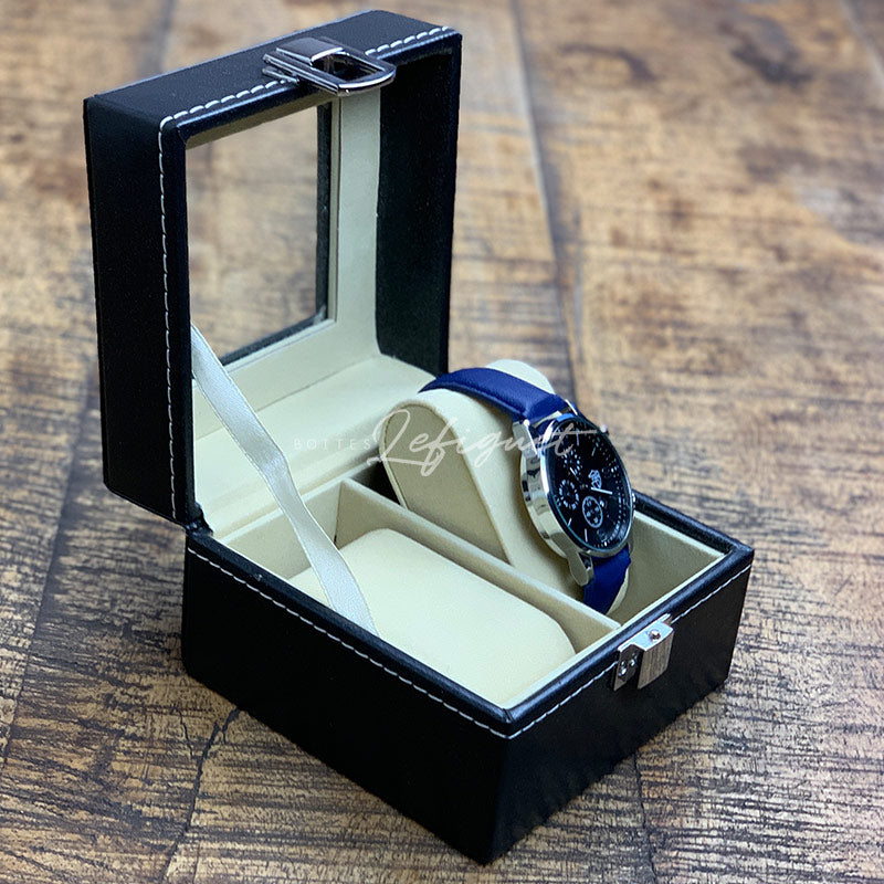 Un écrin Boites-lefiguet.com en cuir noir avec un bracelet bleu.