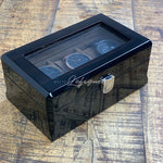 Une Boite à montres Vintage en Bois Foncé Boîte remontoir 3 fentes par Boites Lefiguet sur une table en bois.