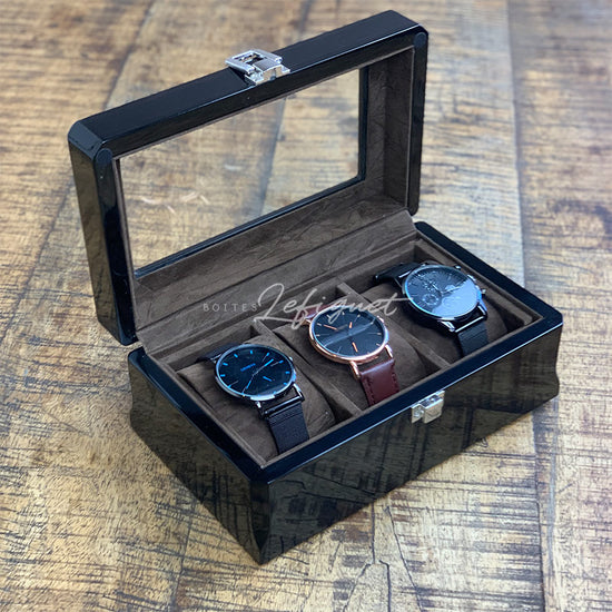 Une boîte noire Boites Lefiguet avec quelques montres Boite à montres Vintage en Bois Foncé 3 slots à l'intérieur.